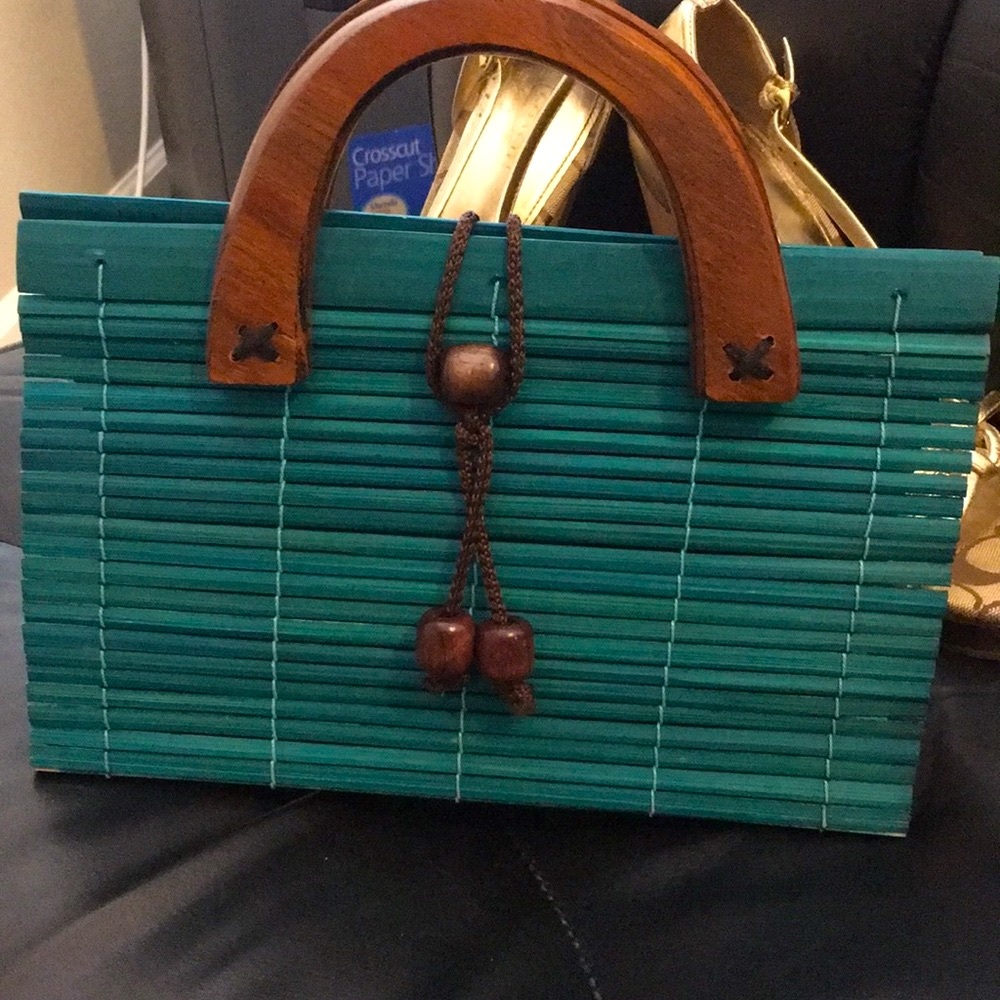 Small vintage wicker bag, a chic wooden handles.